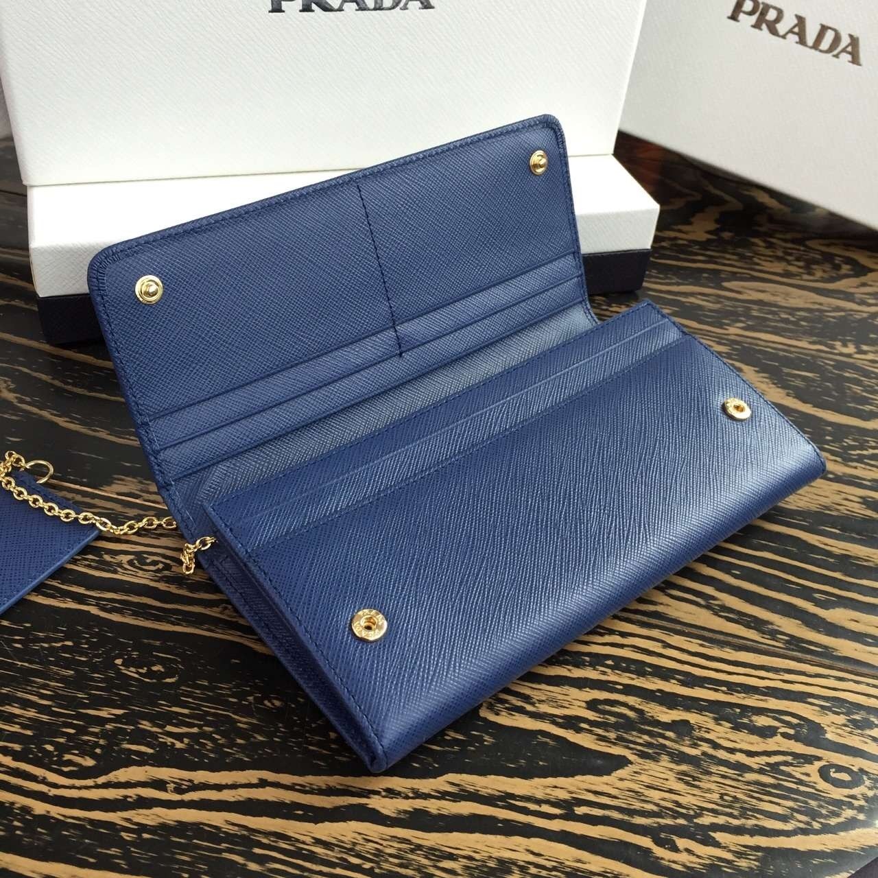 Pra*a continental wallet in blue saffiano leather