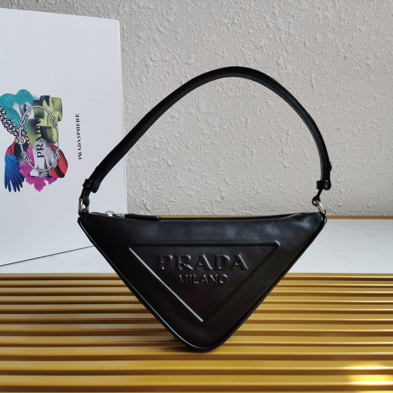 Pra*a triangle pouch bag in black leather