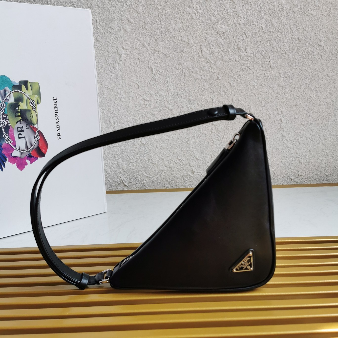 Pra*a triangle pouch bag in black leather