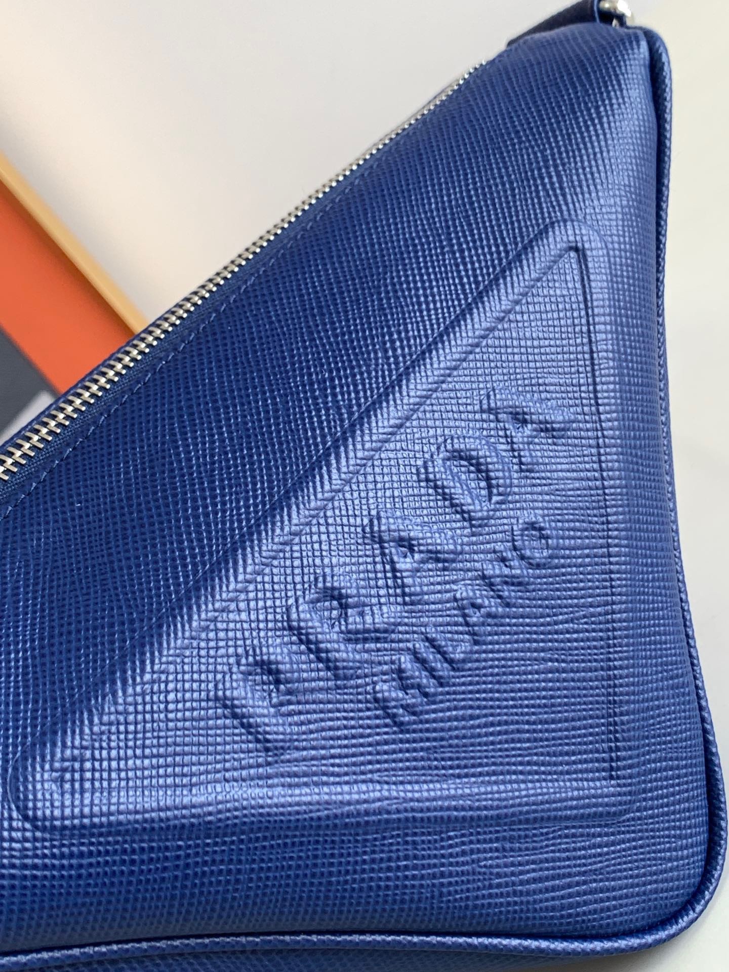Pra*a triangle shoulder bag in blue saffiano calfskin