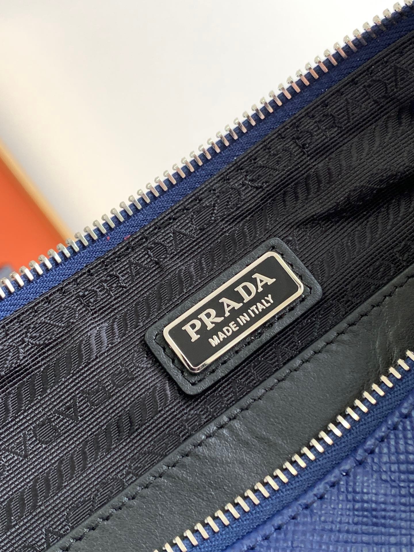 Pra*a triangle shoulder bag in blue saffiano calfskin
