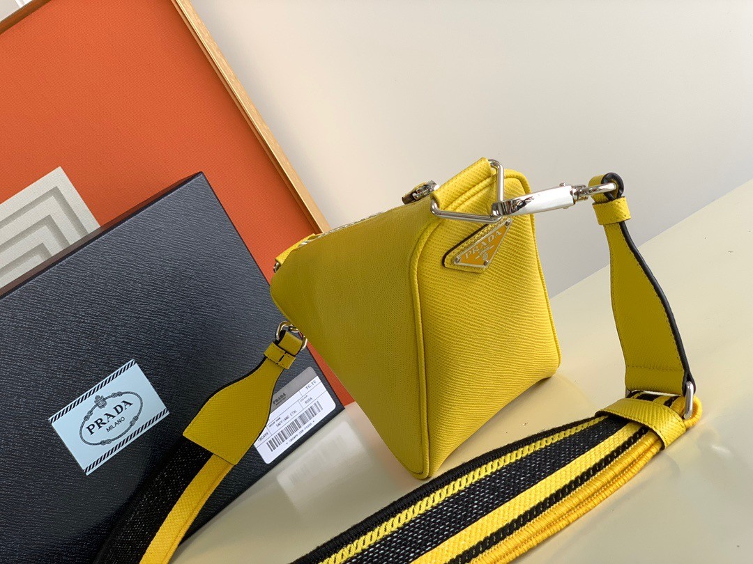 Pra*a triangle shoulder bag in yellow saffiano calfskin
