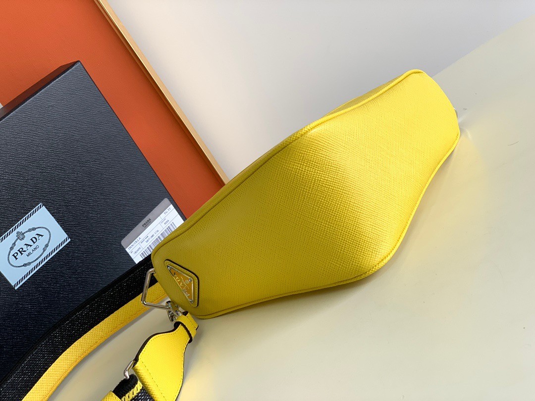 Pra*a triangle shoulder bag in yellow saffiano calfskin