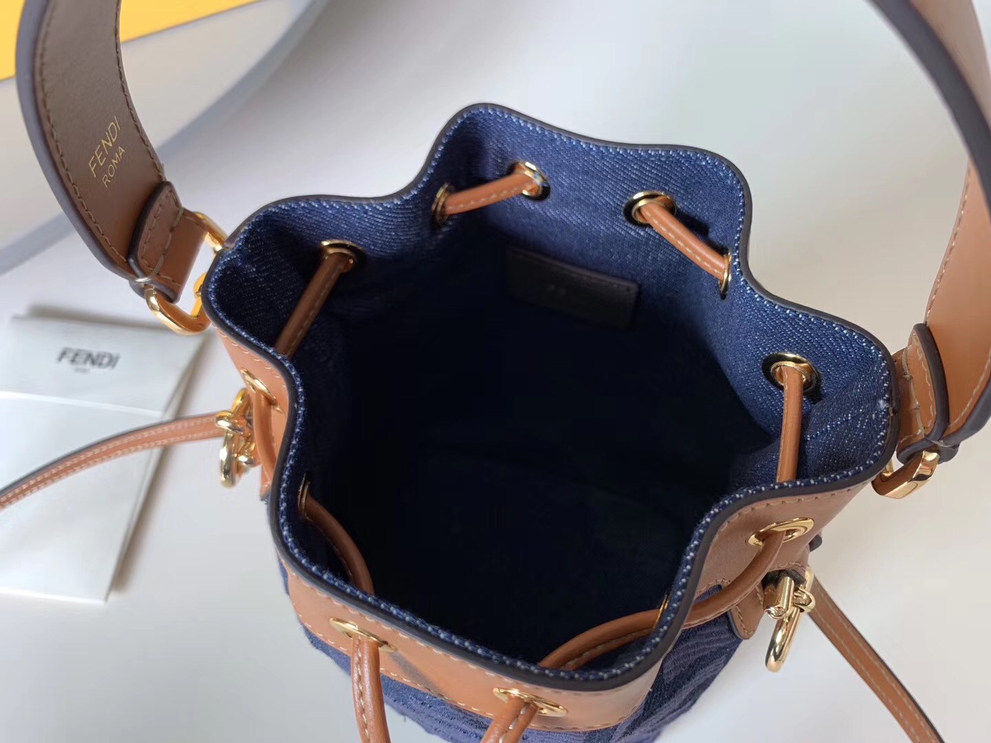 F**di mon tresor mini bucket bag in blue denim