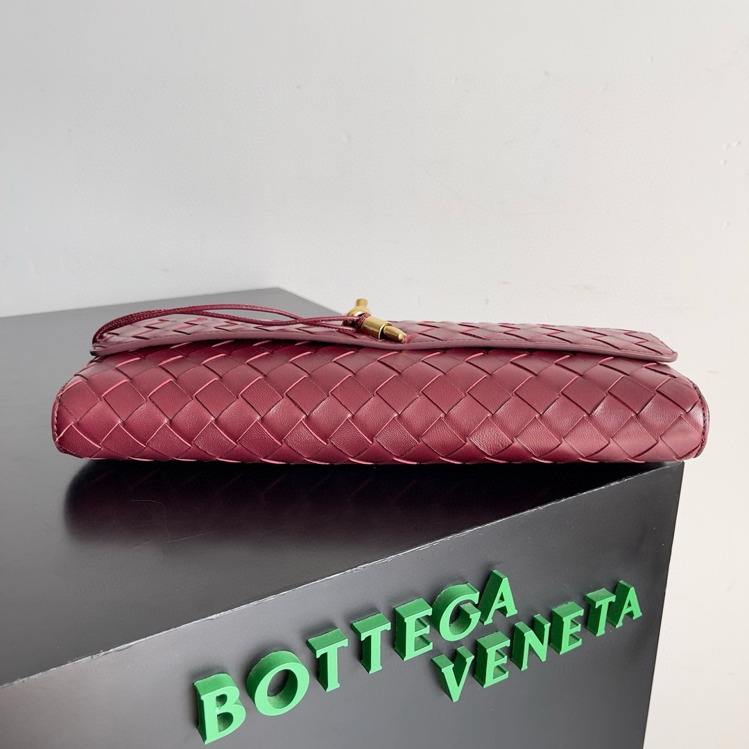 bo*te*ga Ve*ne*ta andiamo clutch with handle in barolo intrecciato lambskin