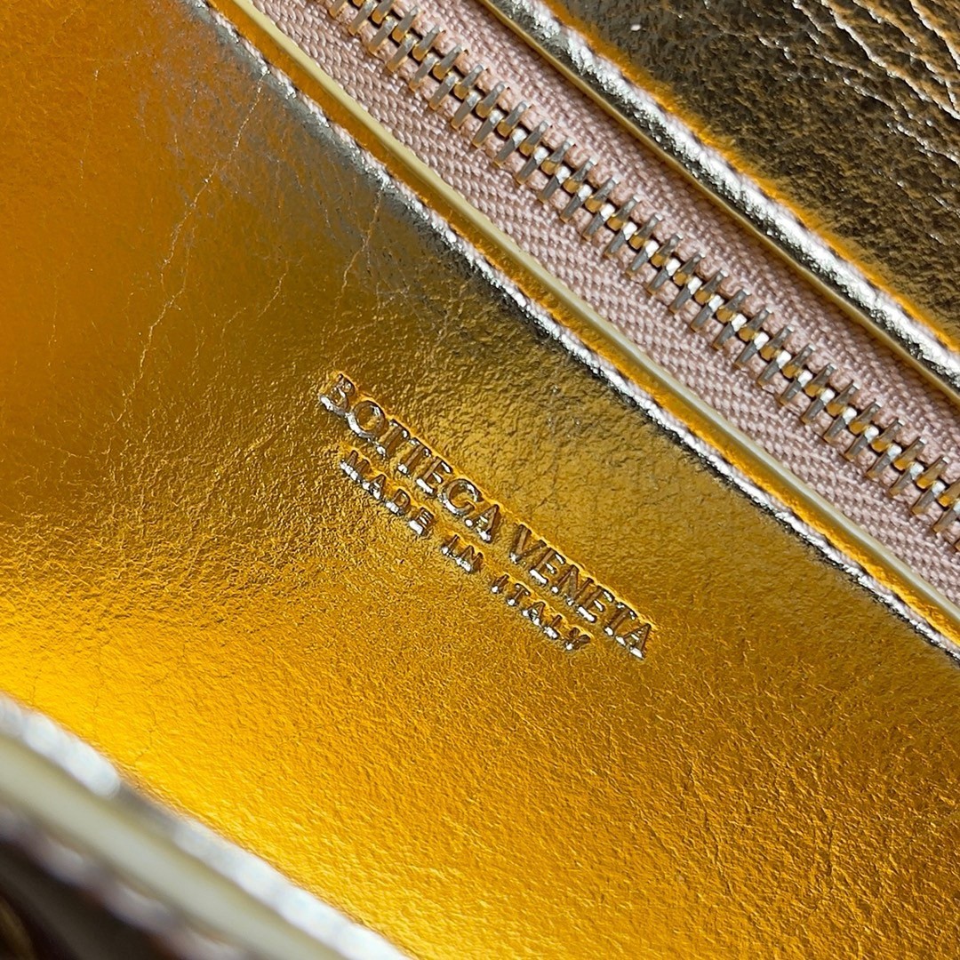 bo*te*ga Ve*ne*ta andiamo clutch with handle in gold metallic leather