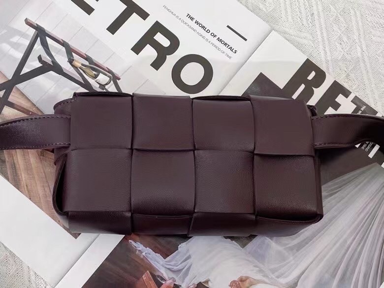 bo*te*ga Ve*ne*ta cassette belt bag in grape intrecciato leather