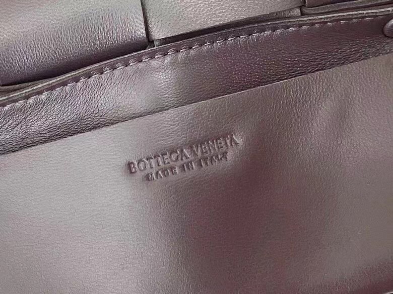 bo*te*ga Ve*ne*ta cassette belt bag in grape intrecciato leather