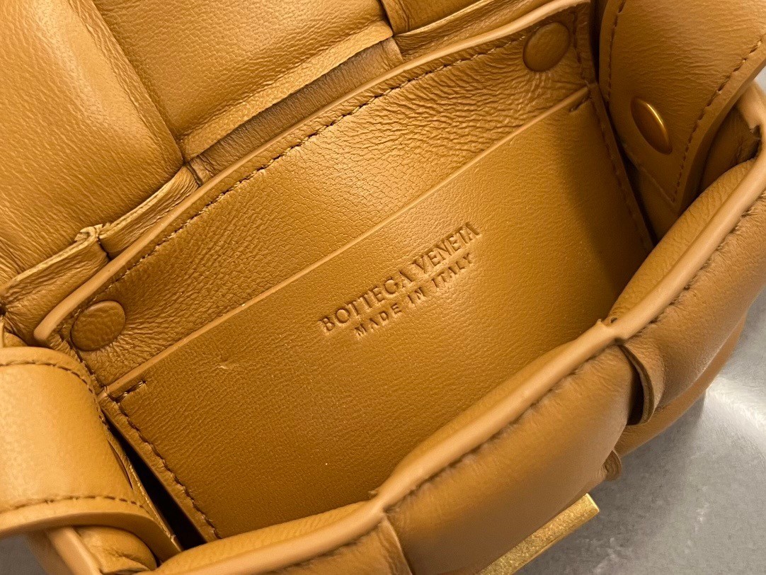 bo*te*ga Ve*ne*ta candy padded cassette bag in camel lambskin