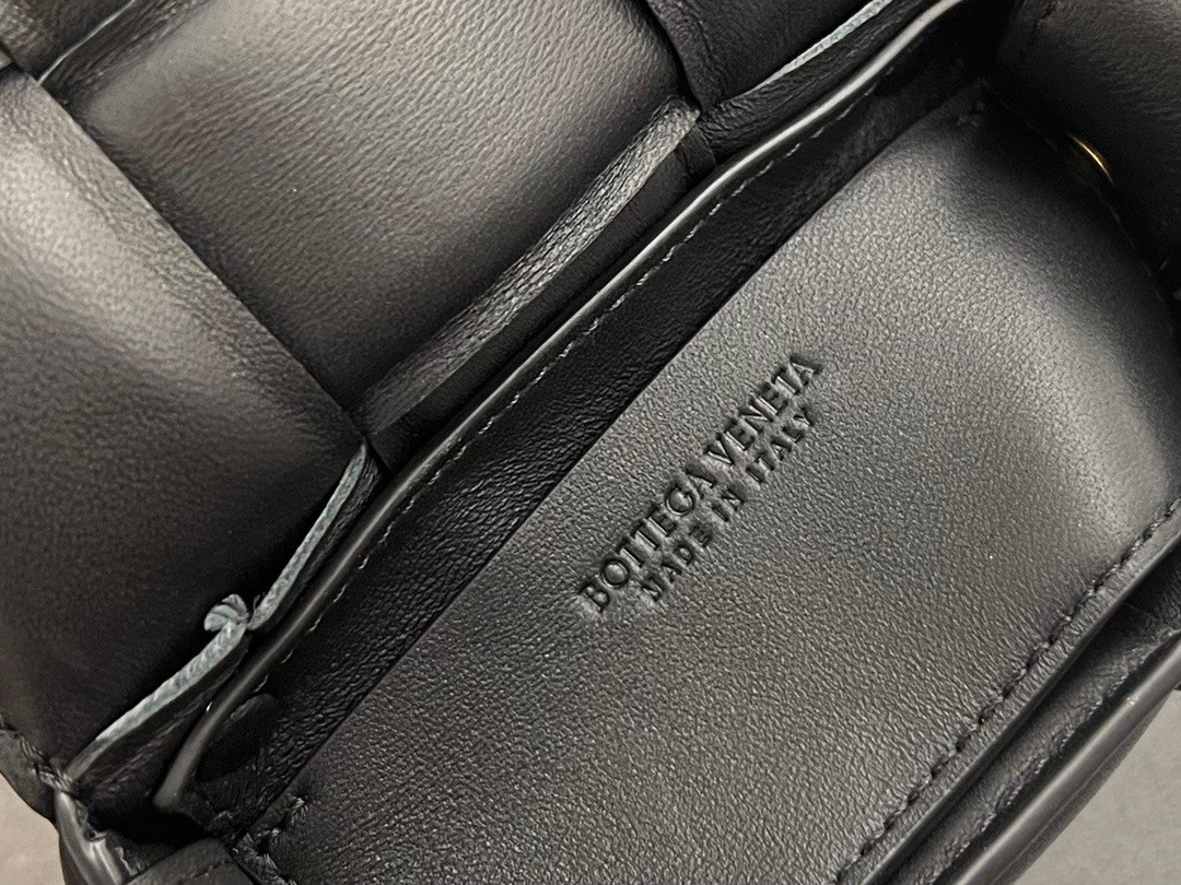 bo*te*ga Ve*ne*ta candy padded cassette bag in black lambskin