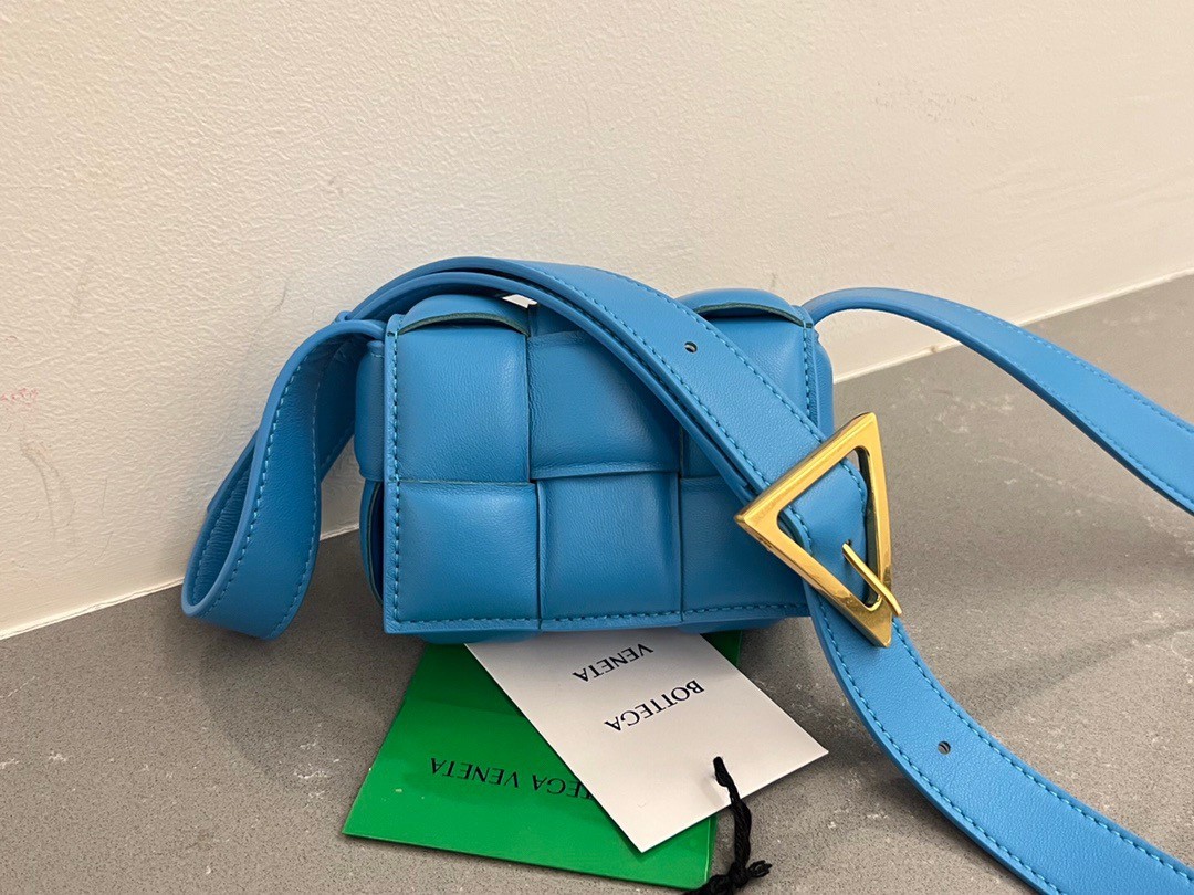 bo*te*ga Ve*ne*ta candy padded cassette bag in pool lambskin