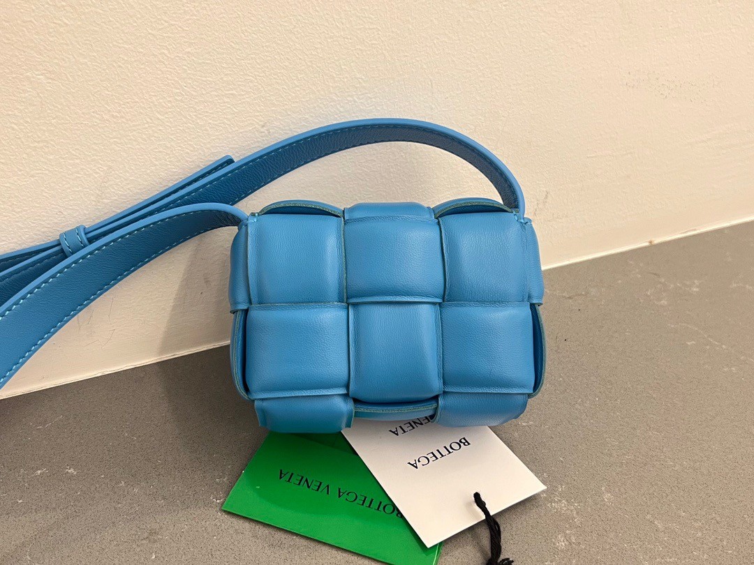 bo*te*ga Ve*ne*ta candy padded cassette bag in pool lambskin