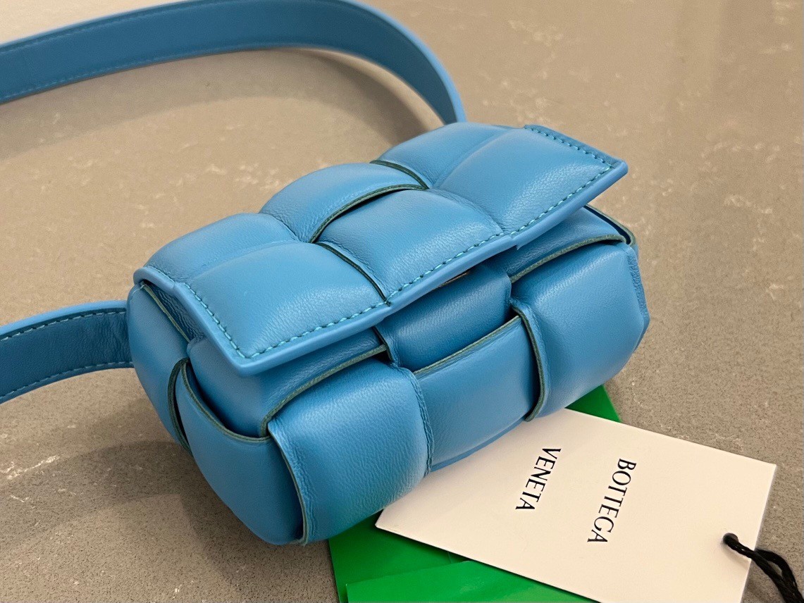 bo*te*ga Ve*ne*ta candy padded cassette bag in pool lambskin