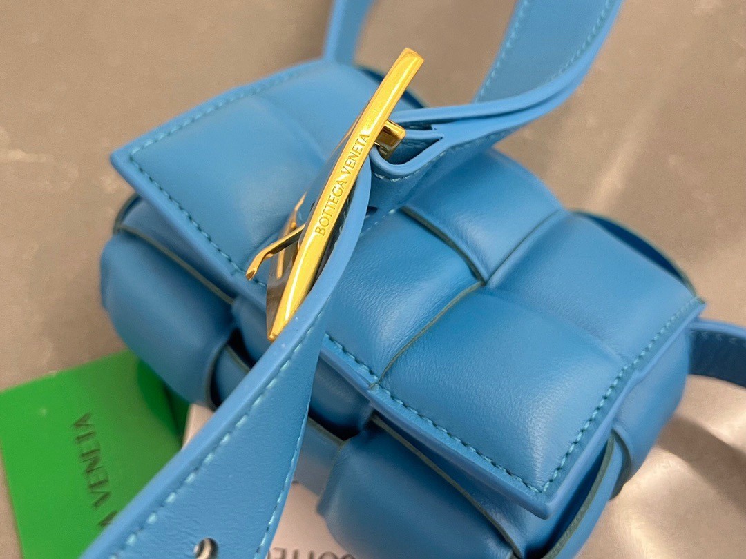 bo*te*ga Ve*ne*ta candy padded cassette bag in pool lambskin