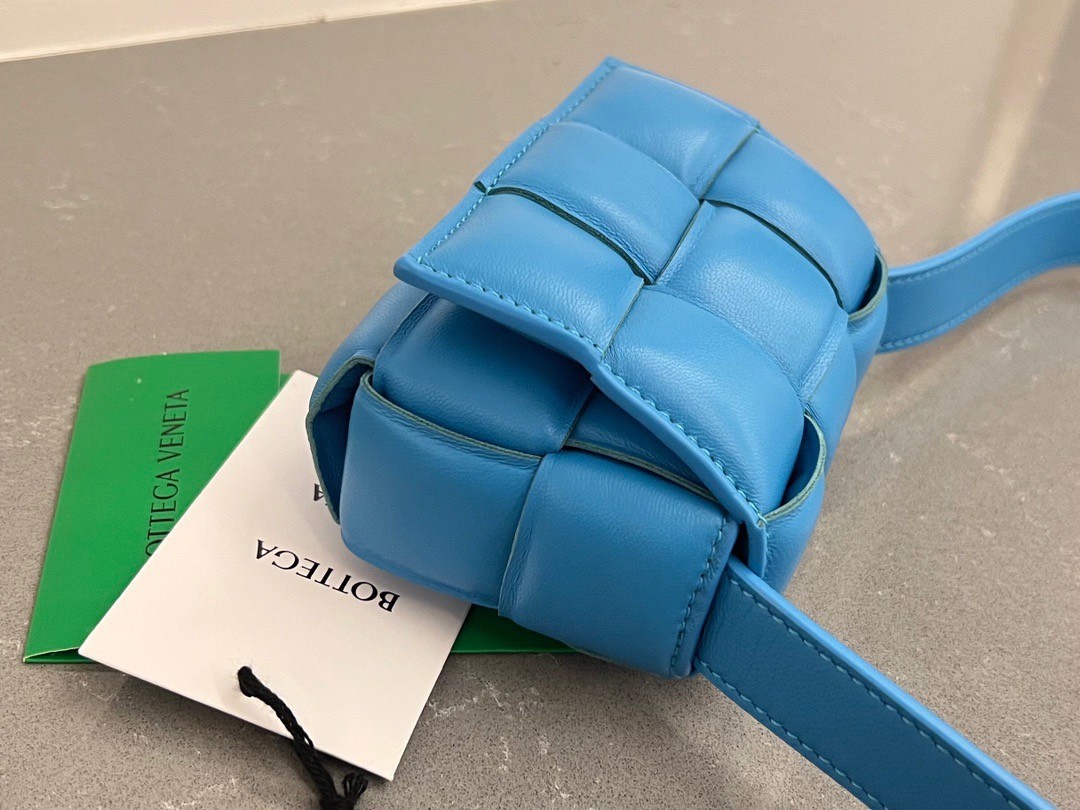 bo*te*ga Ve*ne*ta candy padded cassette bag in pool lambskin