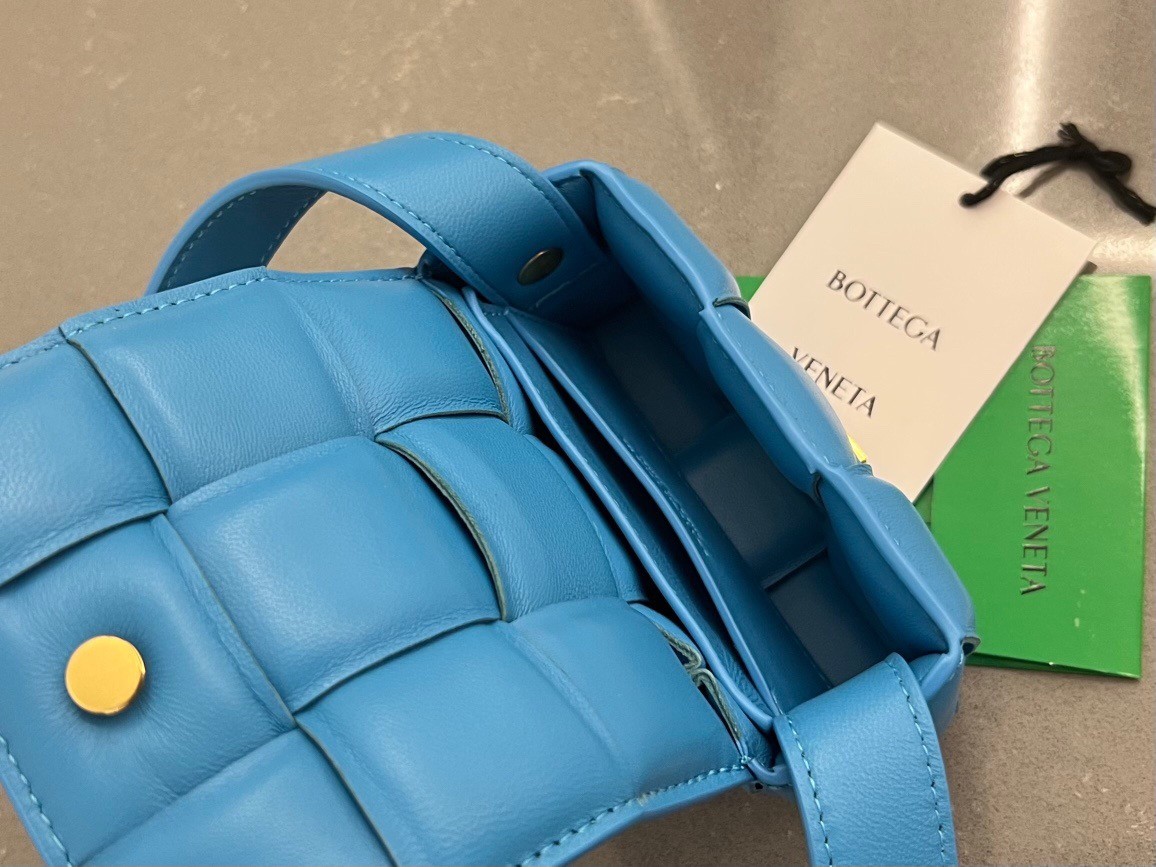bo*te*ga Ve*ne*ta candy padded cassette bag in pool lambskin