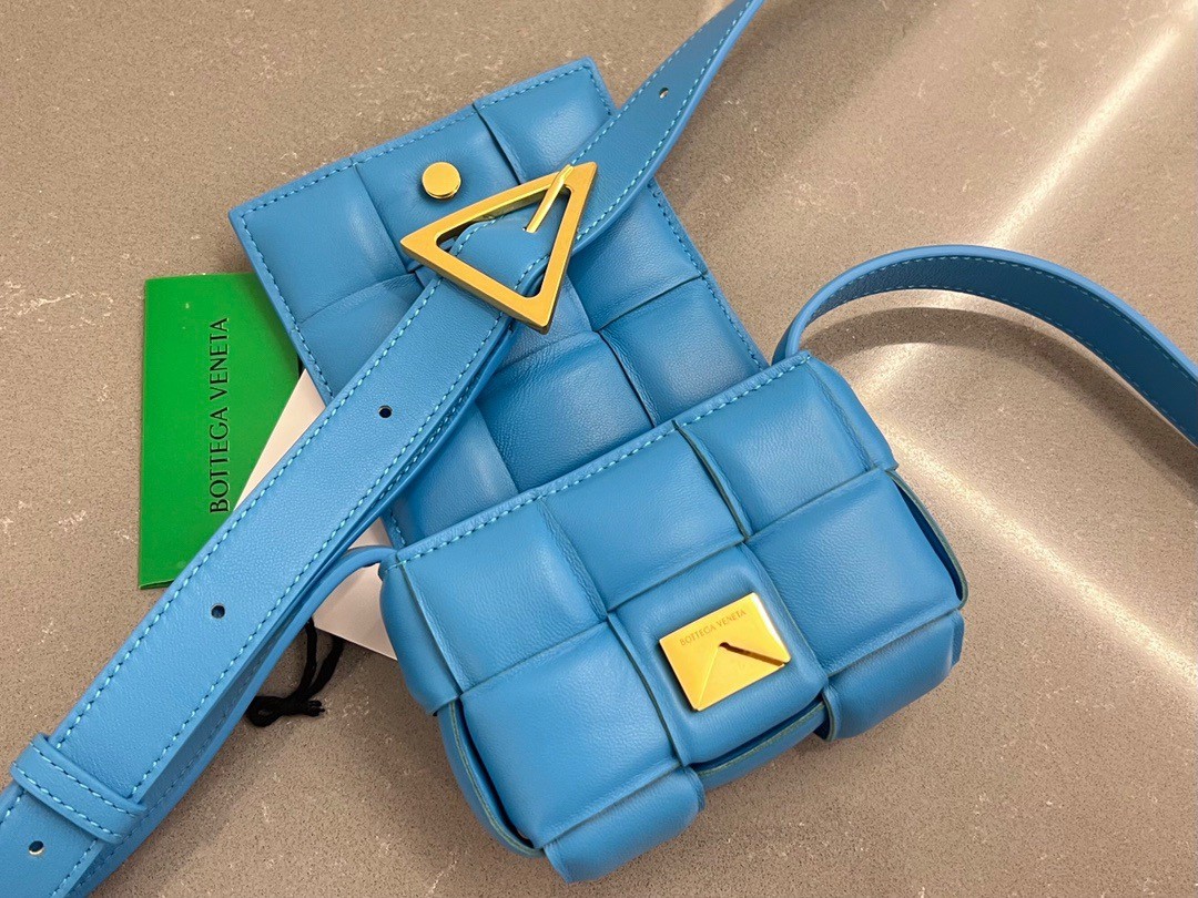 bo*te*ga Ve*ne*ta candy padded cassette bag in pool lambskin