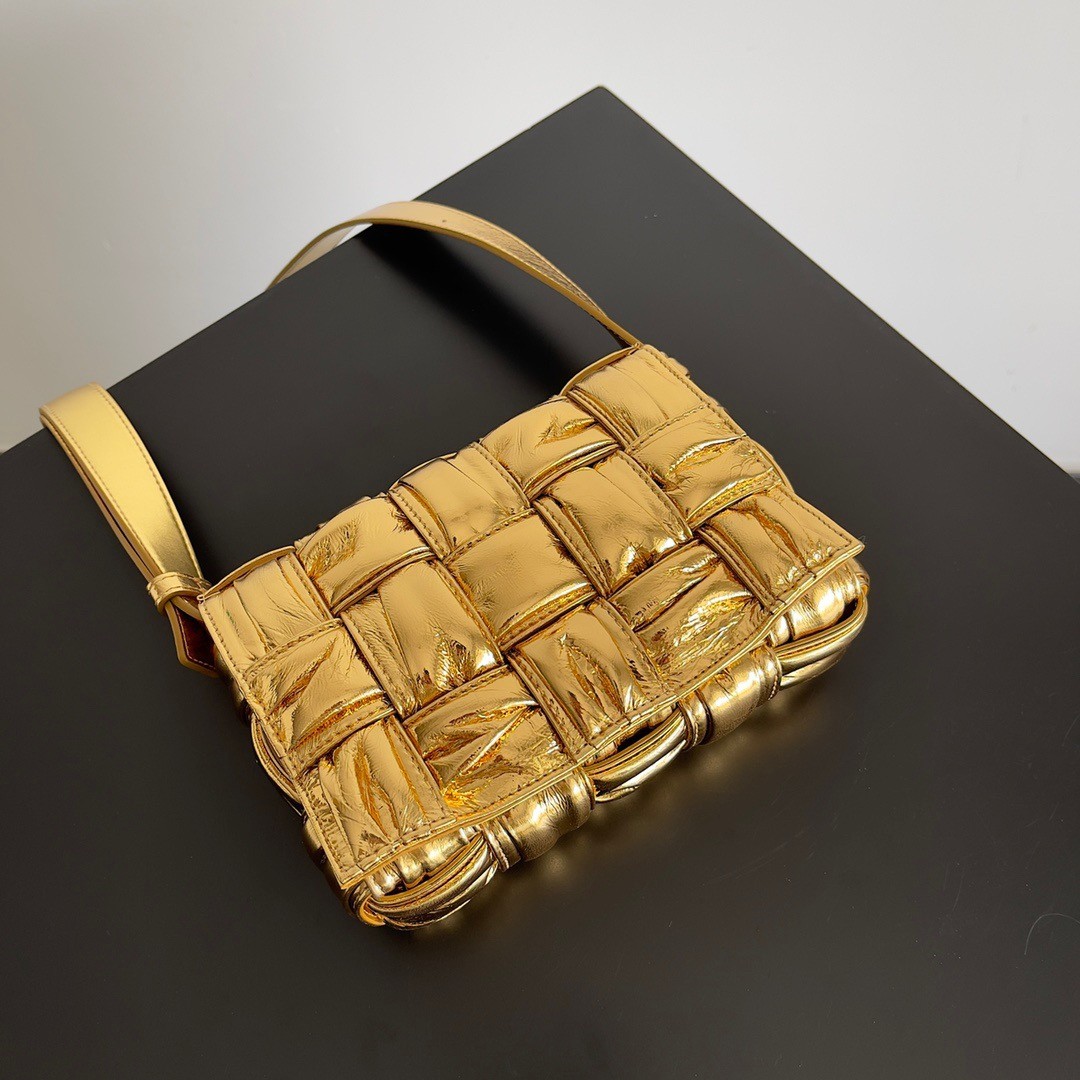 bo*te*ga Ve*ne*ta small cassette bag in gold metallic lambskin