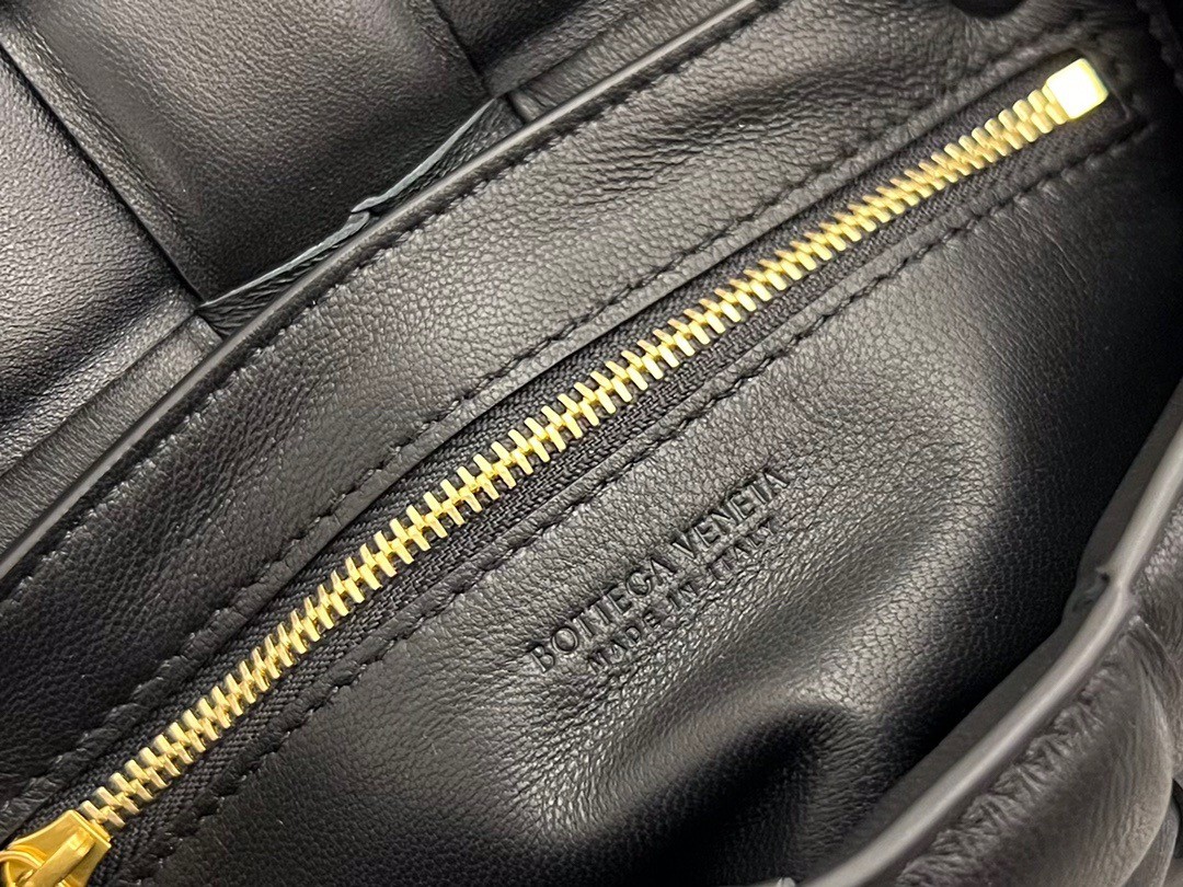 bo*te*ga Ve*ne*ta small padded cassette bag in black lambskin