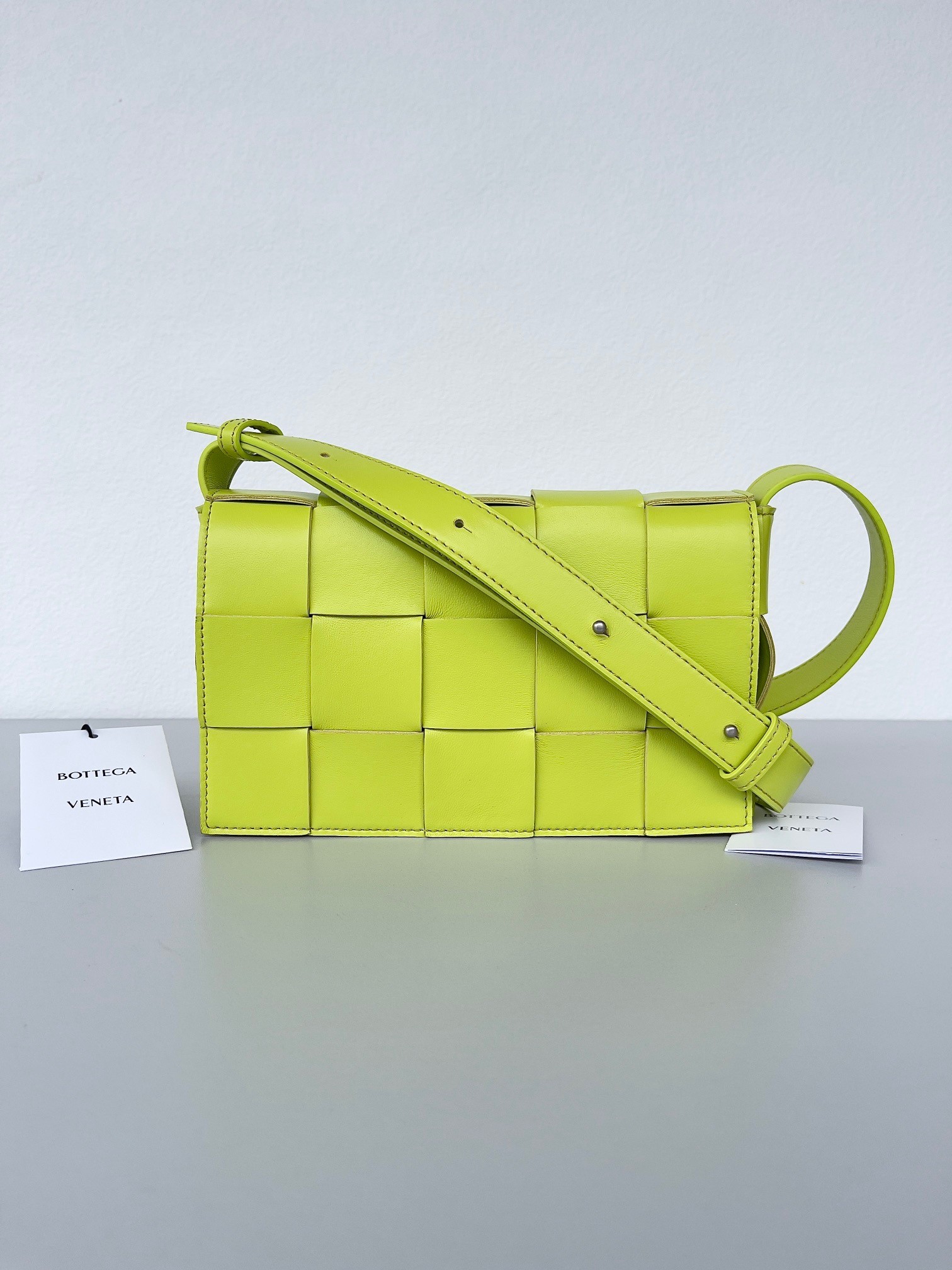 bo*te*ga Ve*ne*ta cassett bag in acid kiwi intrecciato lambskin