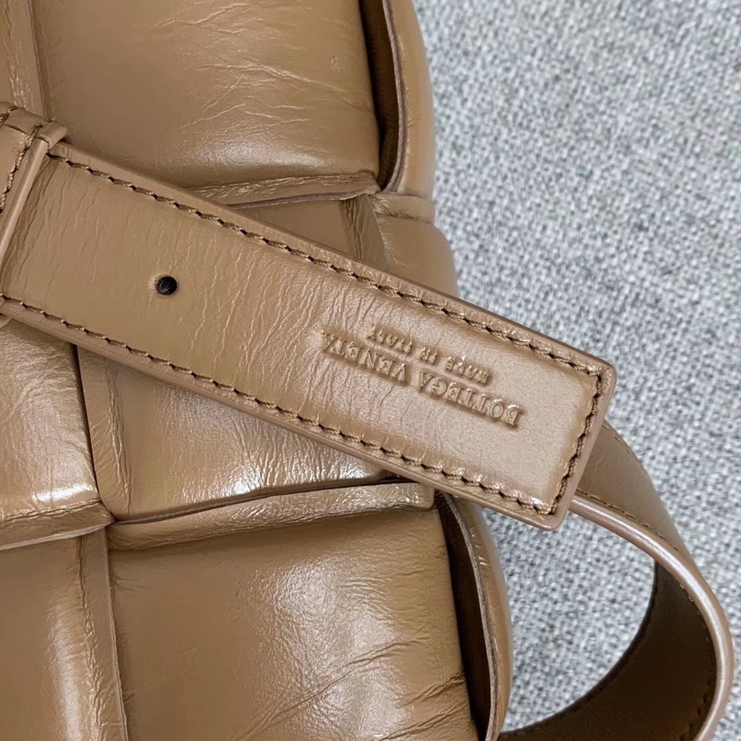 bo*te*ga Ve*ne*ta padded cassette bag in caramel calfskin