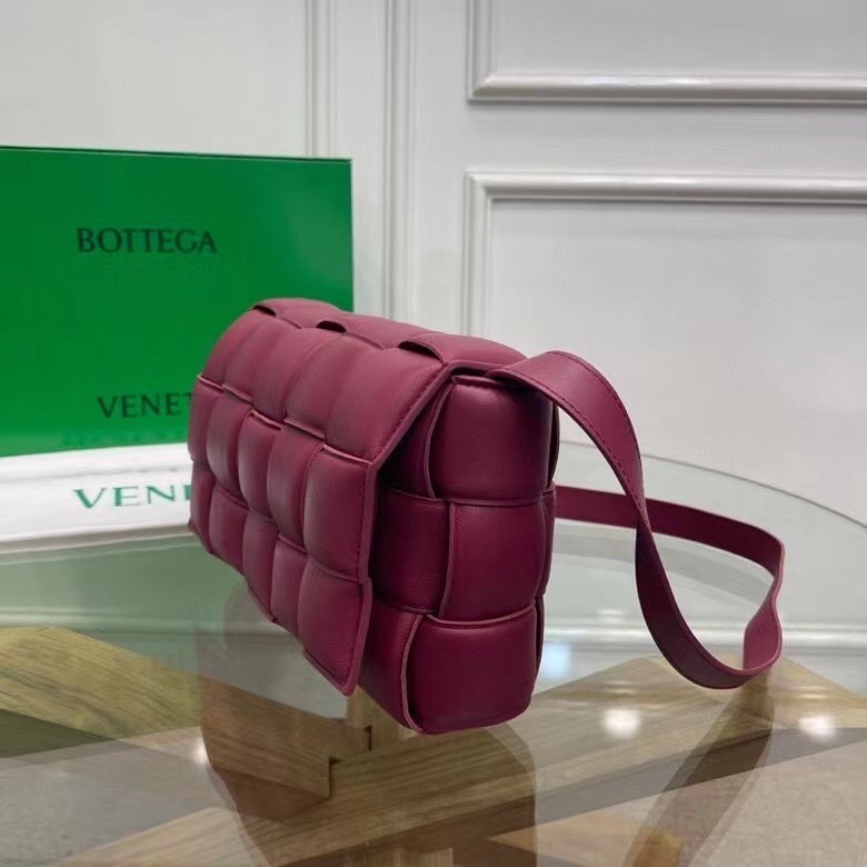 bo*te*ga Ve*ne*ta padded cassette bag in cinnabar calfskin