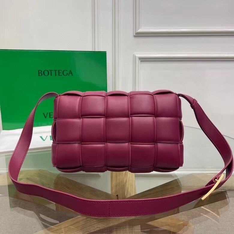 bo*te*ga Ve*ne*ta padded cassette bag in cinnabar calfskin