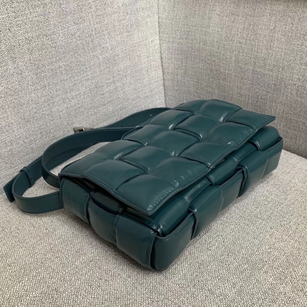 bo*te*ga Ve*ne*ta padded cassette bag in green calfskin