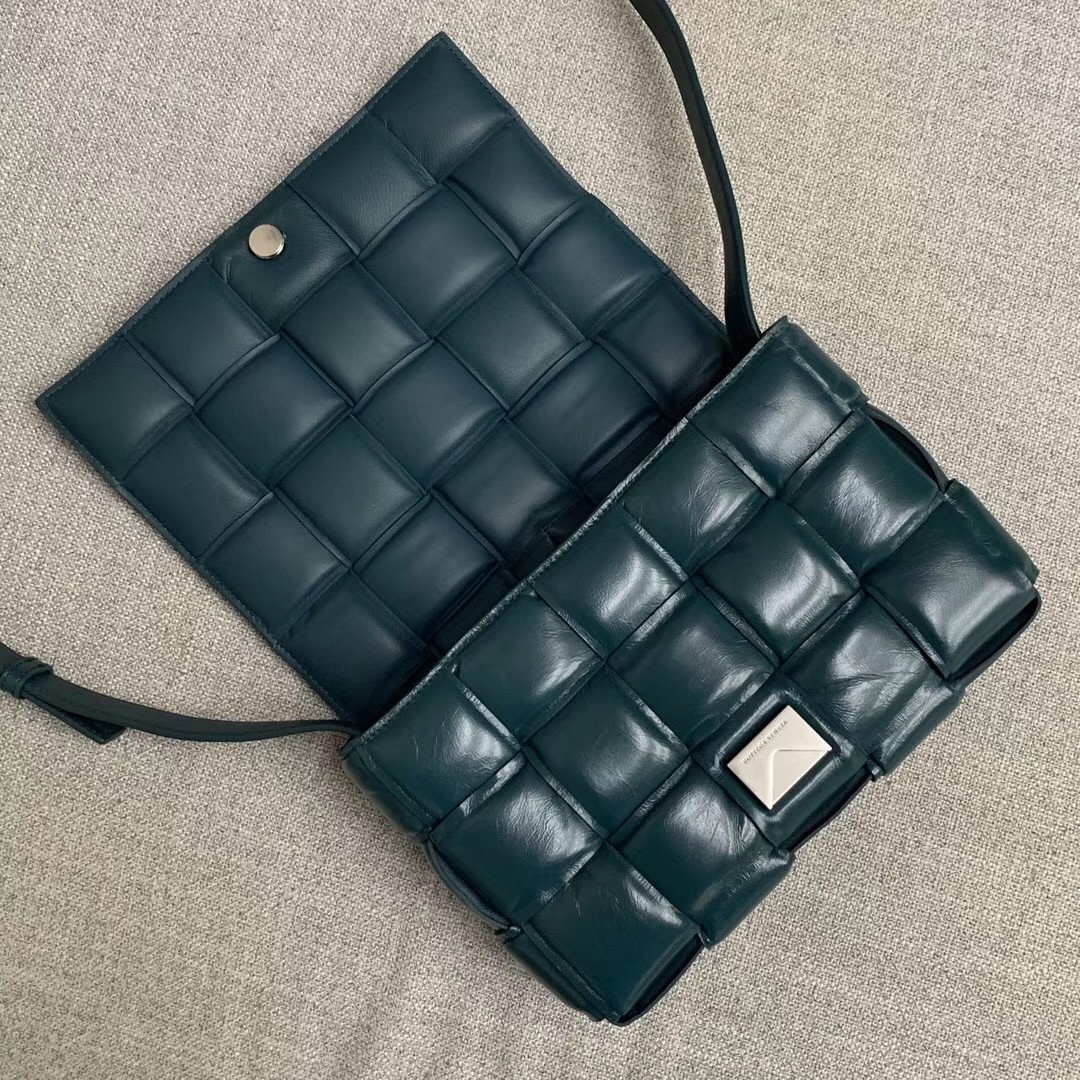 bo*te*ga Ve*ne*ta padded cassette bag in green calfskin