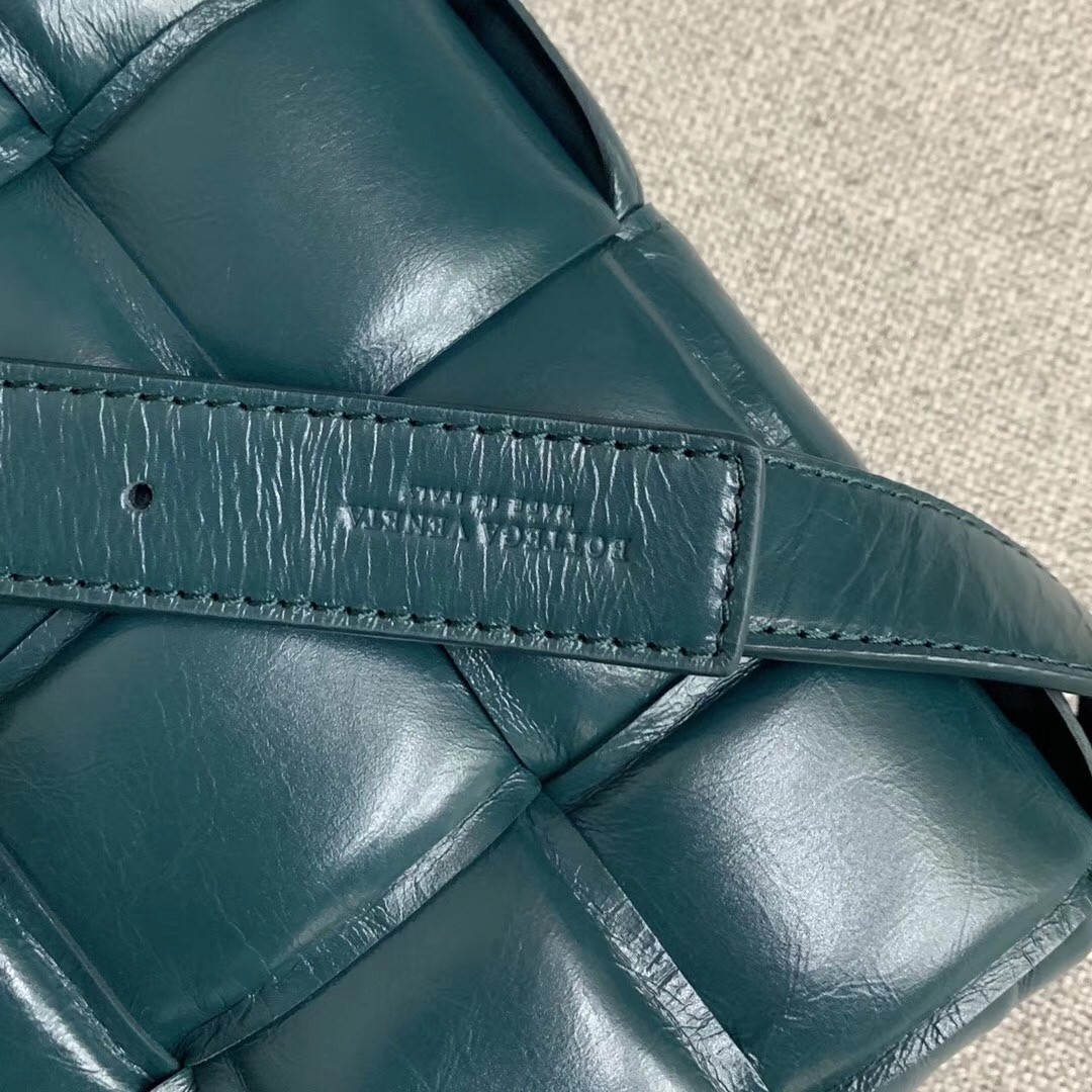 bo*te*ga Ve*ne*ta padded cassette bag in green calfskin