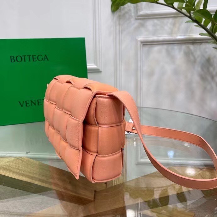 bo*te*ga Ve*ne*ta padded cassette bag in peachy calfskin