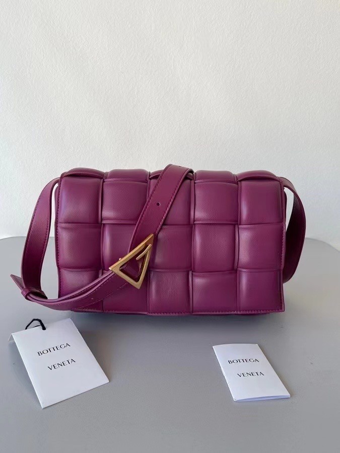 bo*te*ga Ve*ne*ta padded cassette bag in cinnabar lambskin