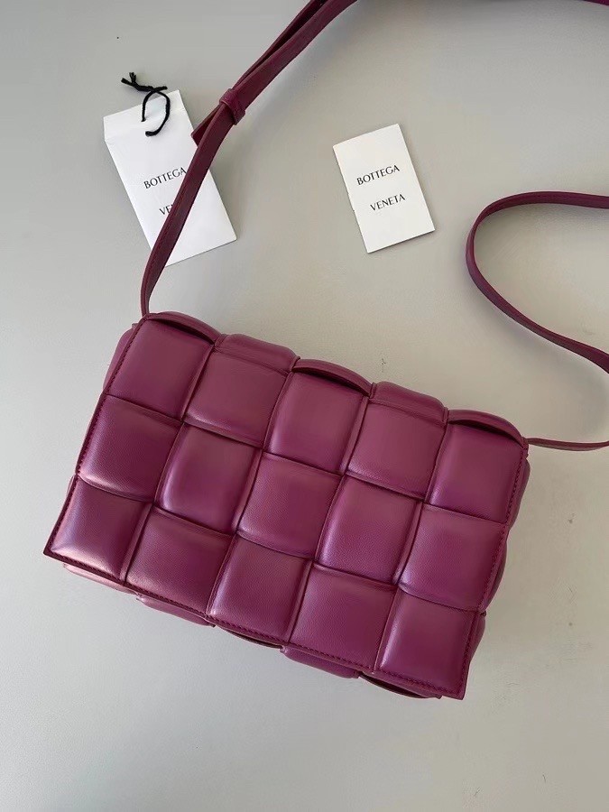 bo*te*ga Ve*ne*ta padded cassette bag in cinnabar lambskin