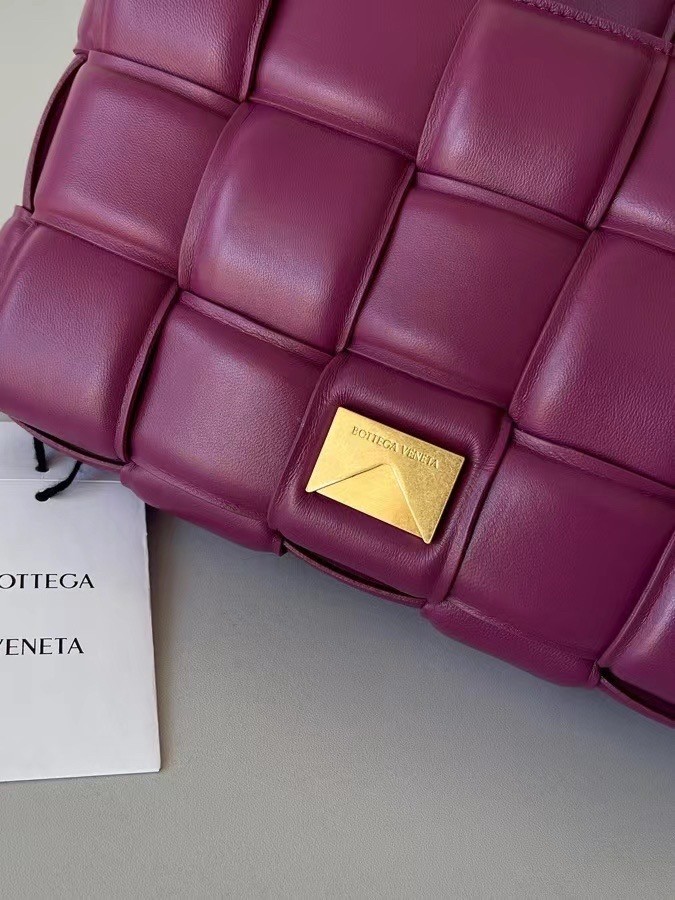 bo*te*ga Ve*ne*ta padded cassette bag in cinnabar lambskin