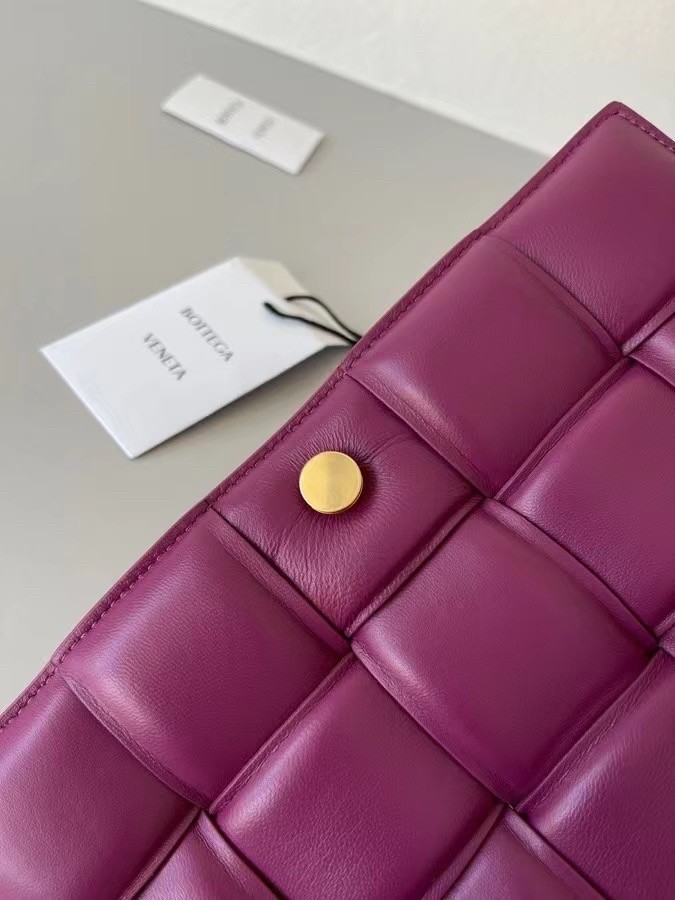 bo*te*ga Ve*ne*ta padded cassette bag in cinnabar lambskin