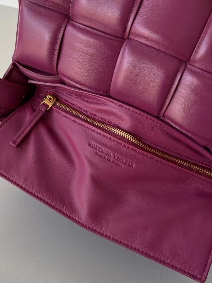 bo*te*ga Ve*ne*ta padded cassette bag in cinnabar lambskin