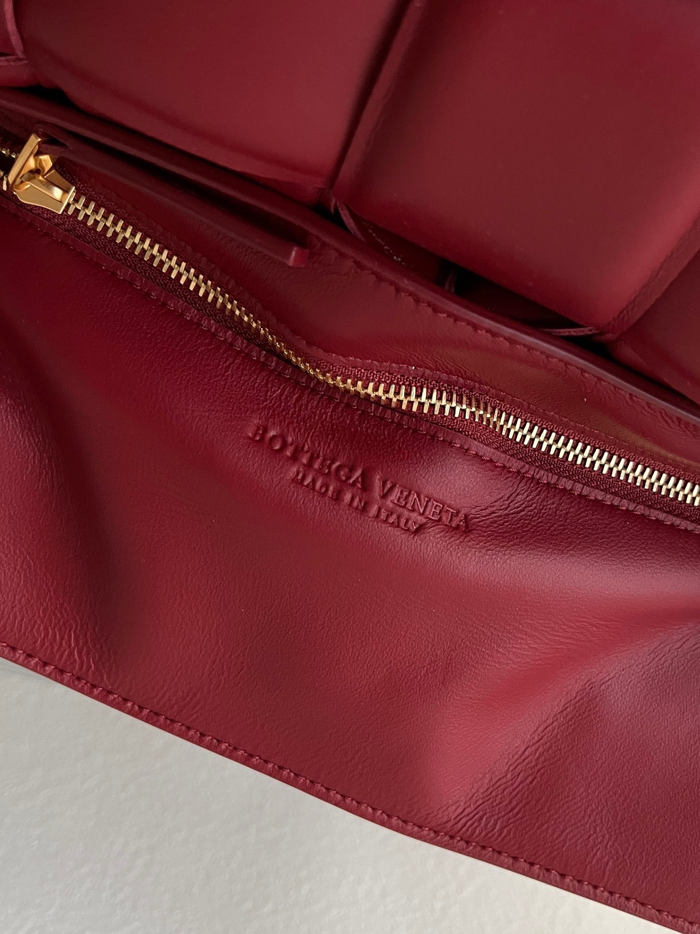bo*te*ga Ve*ne*ta padded cassette bag in dard red lambskin