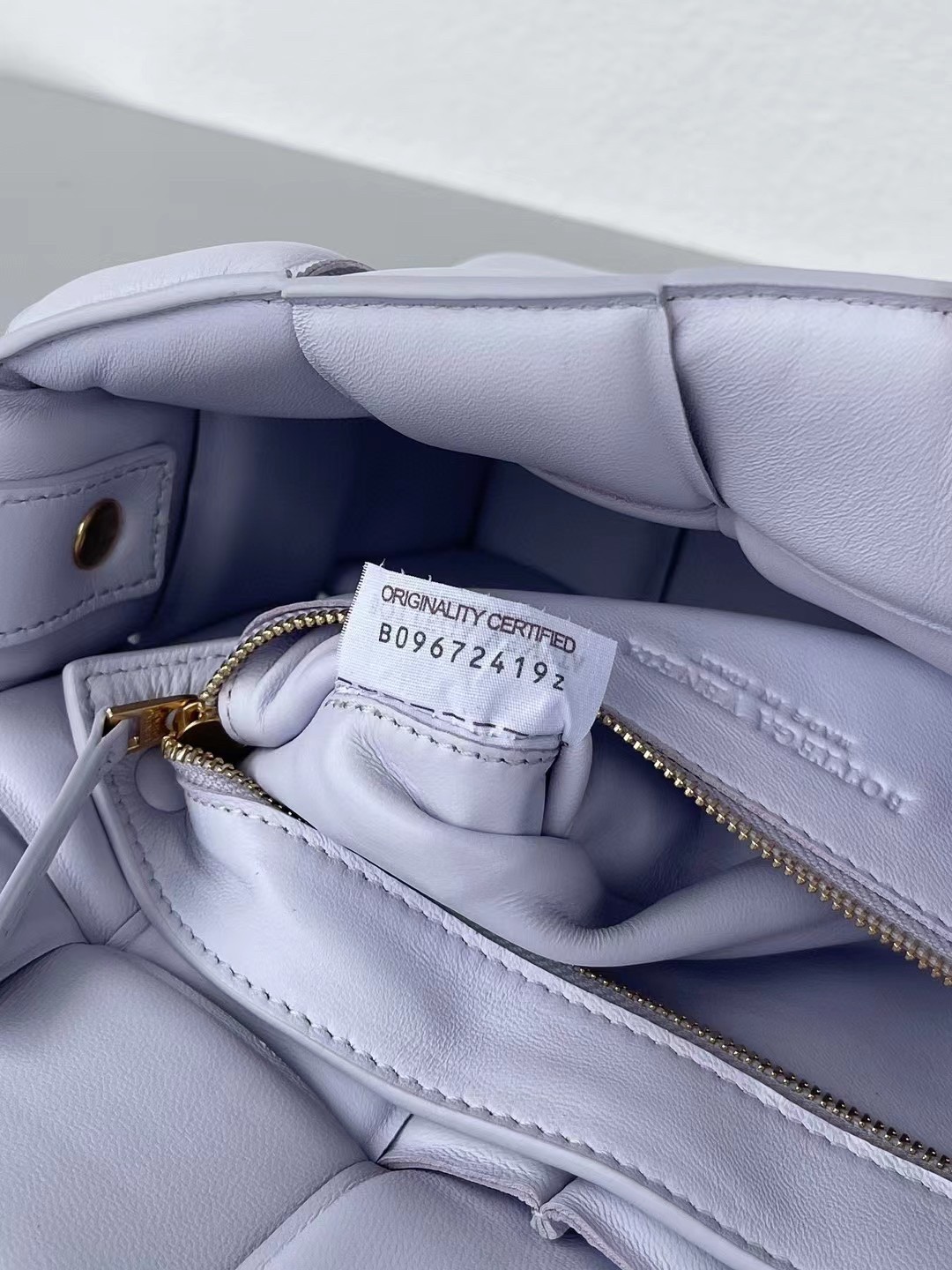 bo*te*ga Ve*ne*ta padded cassette bag in lilas lambskin