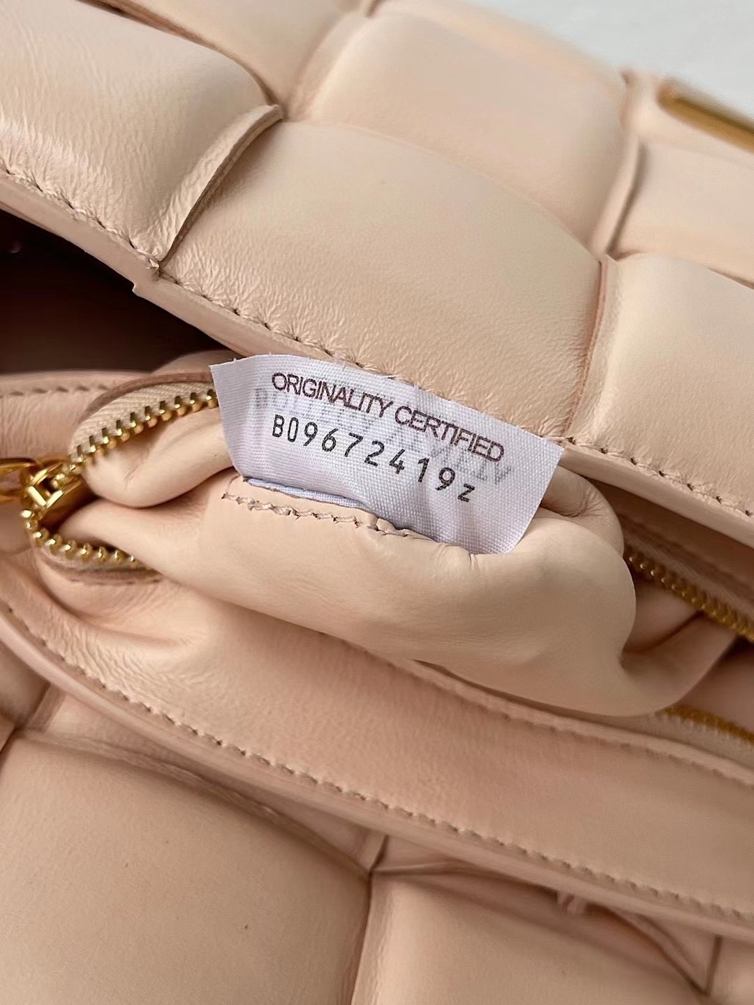 bo*te*ga Ve*ne*ta padded cassette bag in melon lambskin