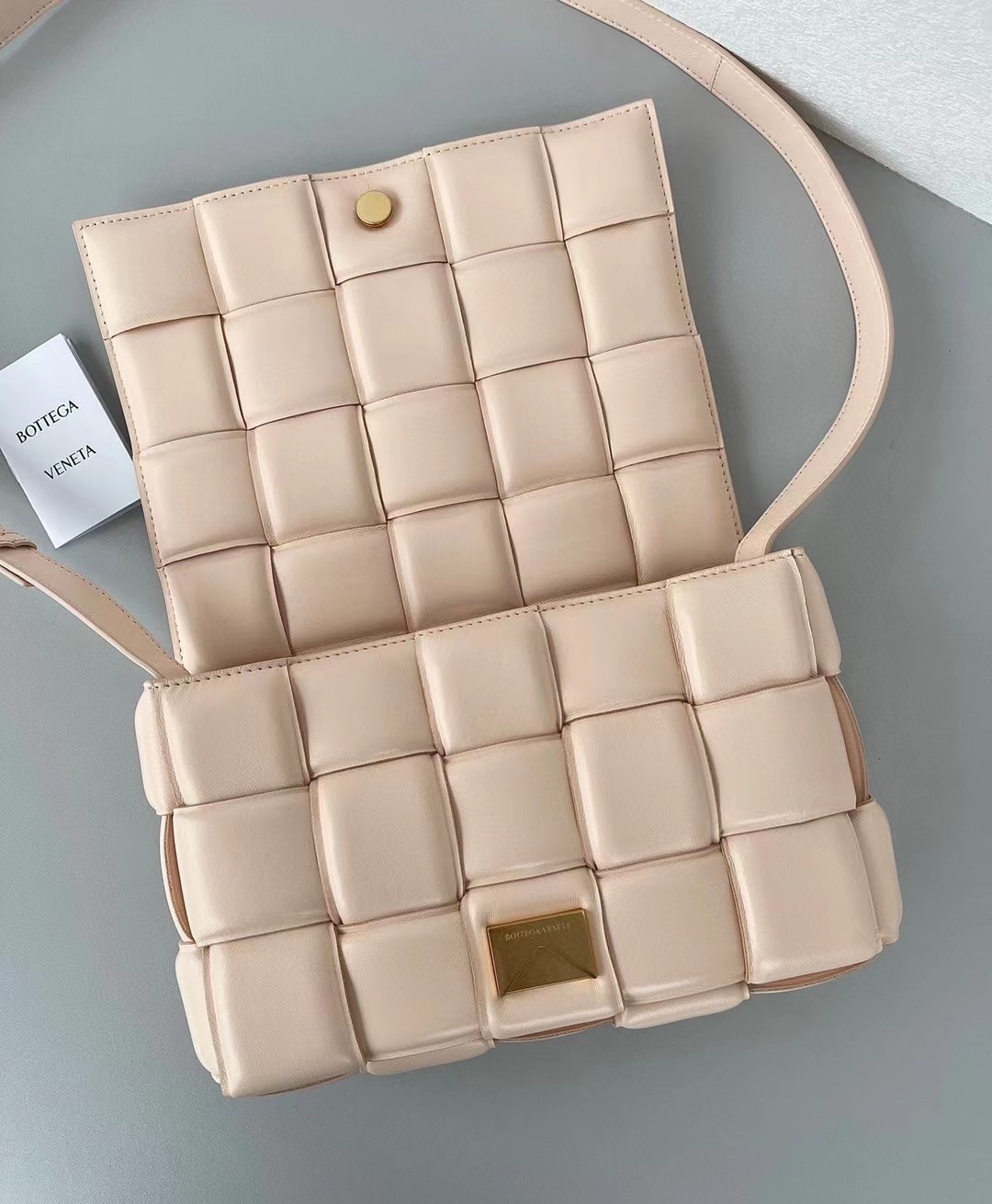 bo*te*ga Ve*ne*ta padded cassette bag in melon lambskin