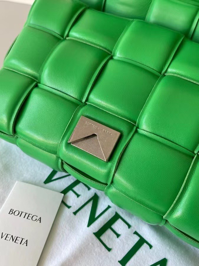 bo*te*ga Ve*ne*ta padded cassette bag in green lambskin