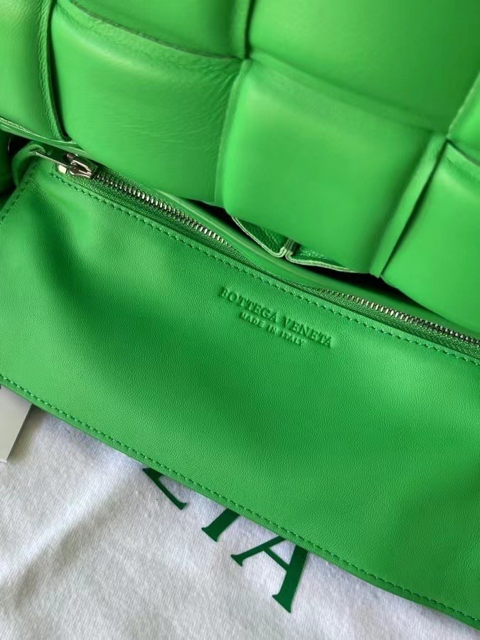 bo*te*ga Ve*ne*ta padded cassette bag in green lambskin