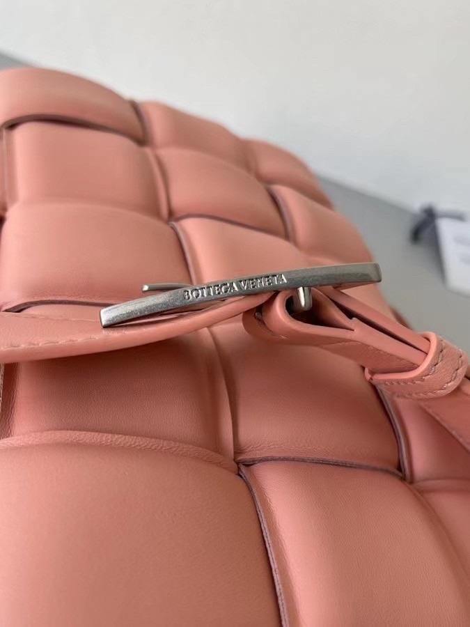 bo*te*ga Ve*ne*ta padded cassette bag in peachy lambskin