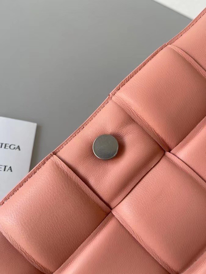 bo*te*ga Ve*ne*ta padded cassette bag in peachy lambskin