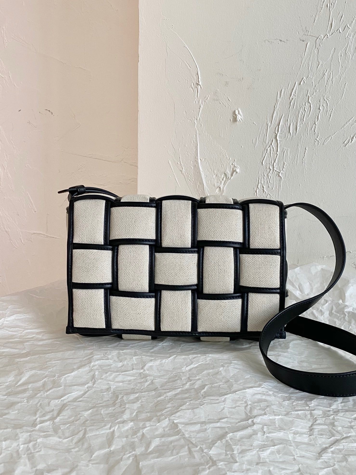 bo*te*ga Ve*ne*ta padded cassette bag in natural canvas