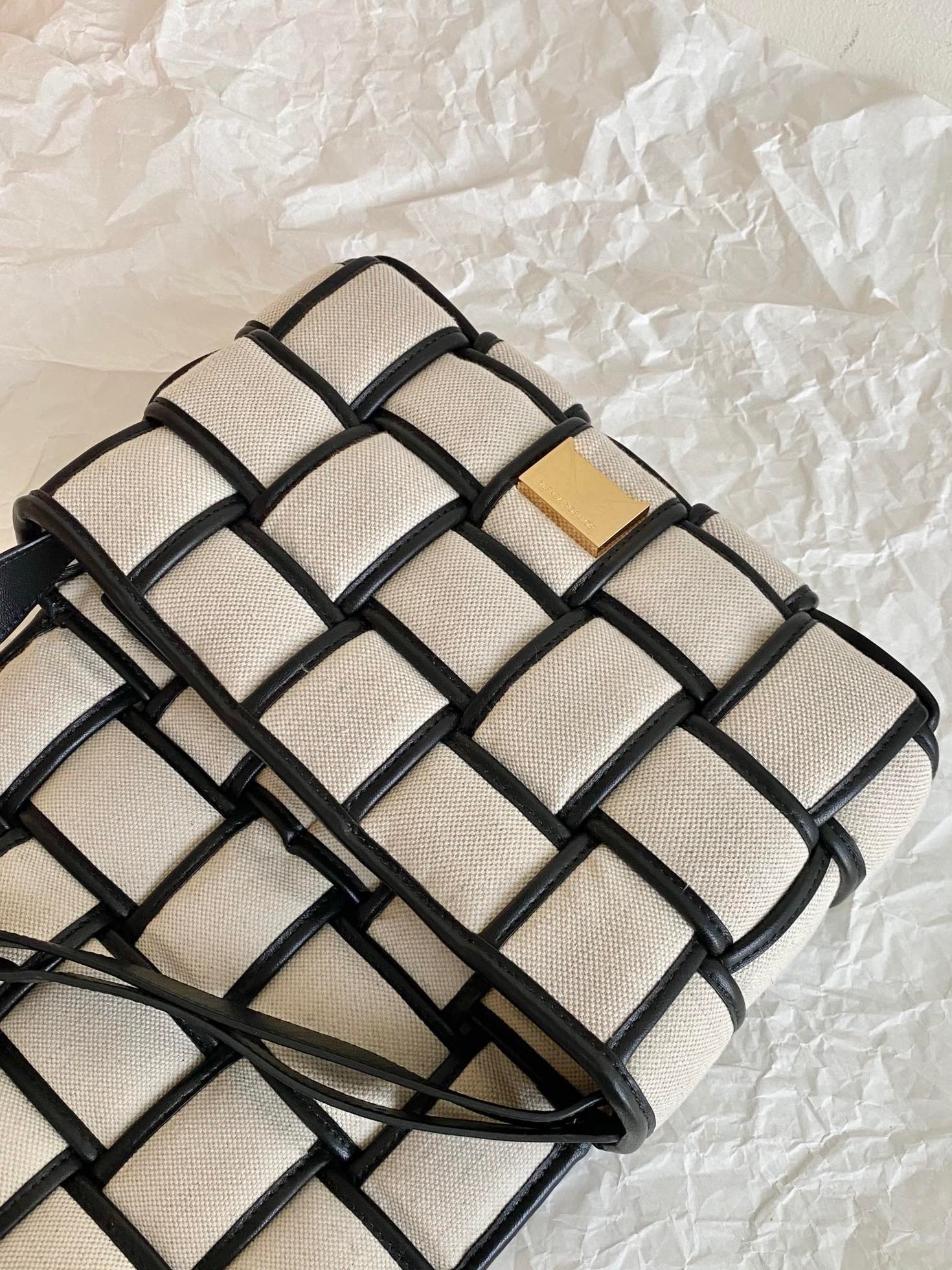 bo*te*ga Ve*ne*ta padded cassette bag in natural canvas
