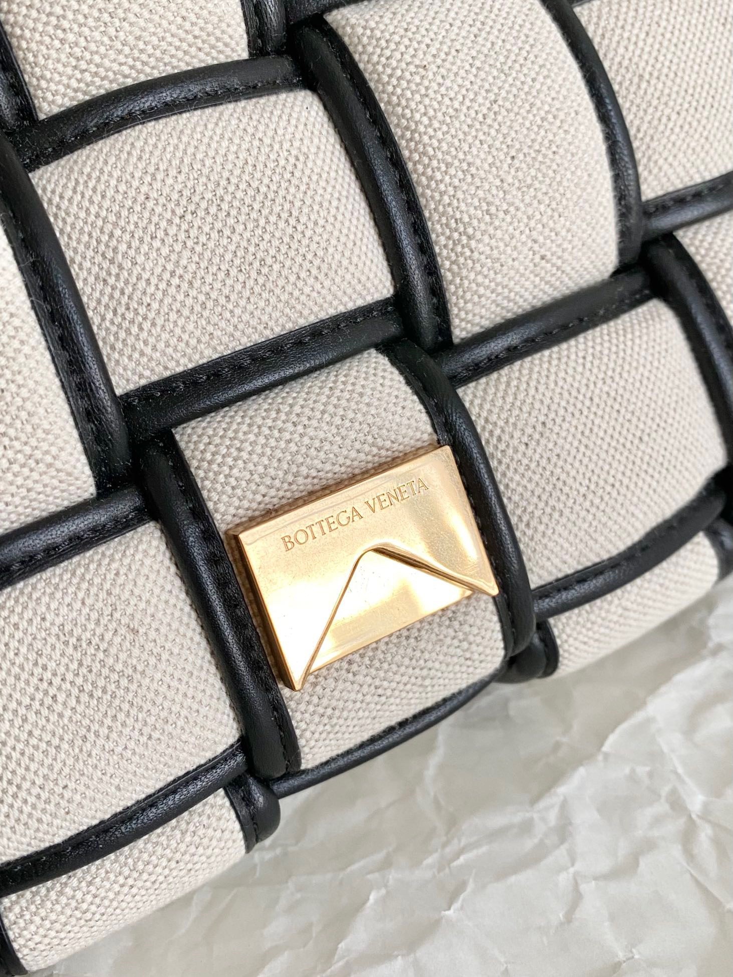 bo*te*ga Ve*ne*ta padded cassette bag in natural canvas