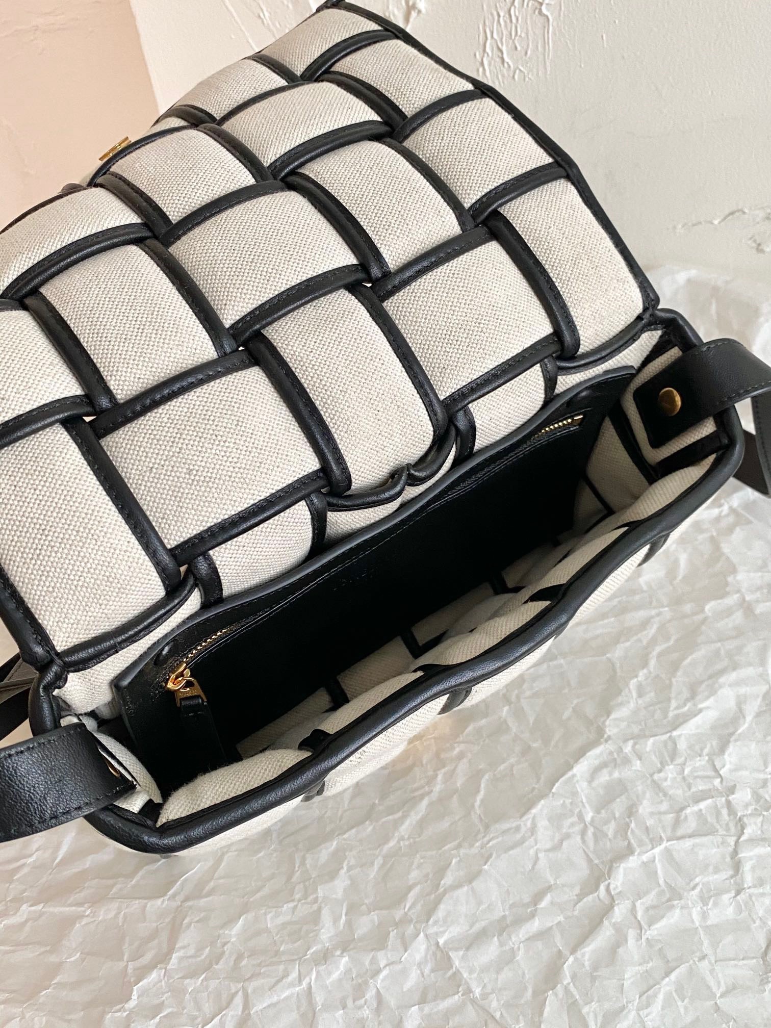 bo*te*ga Ve*ne*ta padded cassette bag in natural canvas