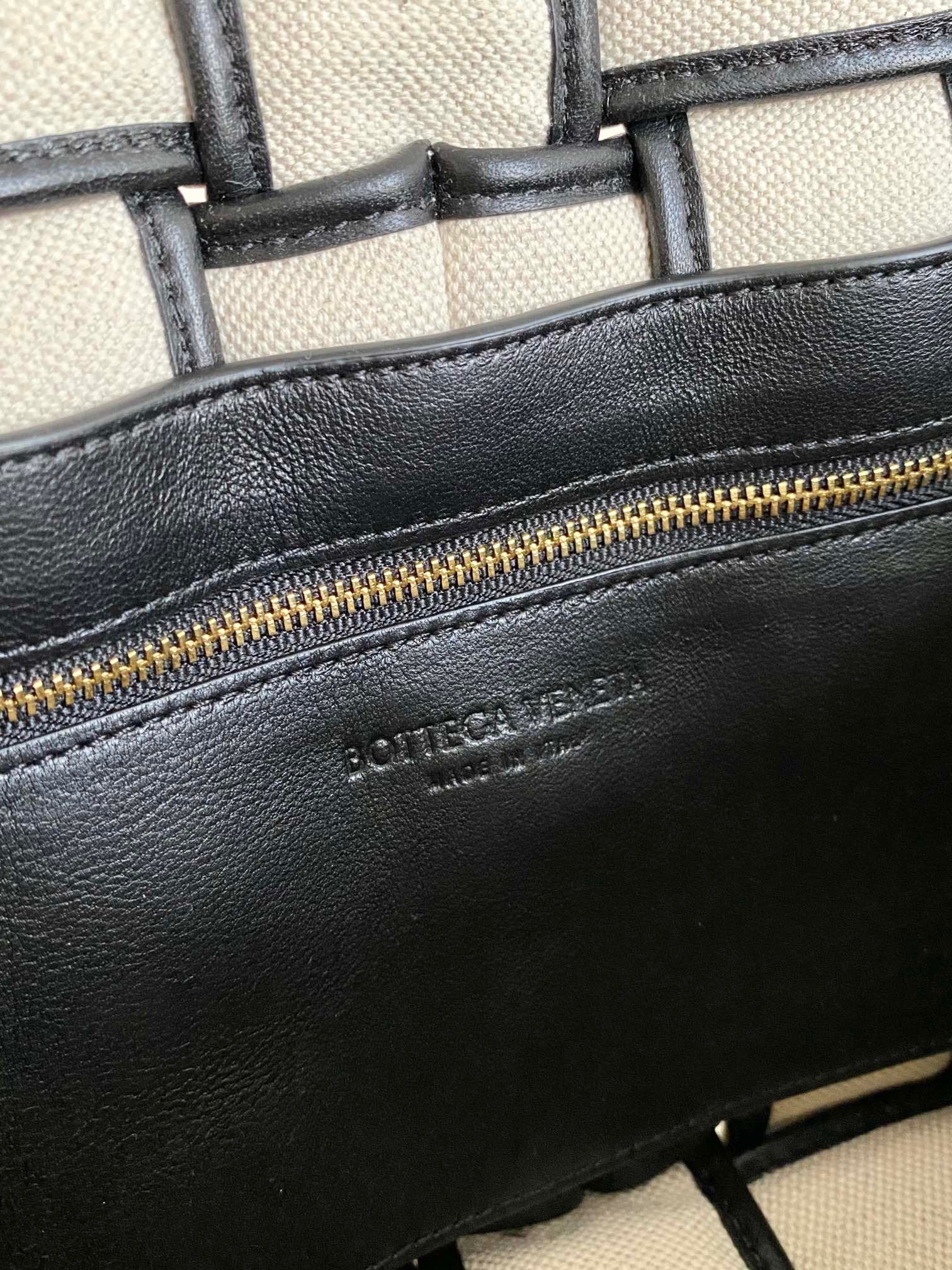 bo*te*ga Ve*ne*ta padded cassette bag in natural canvas