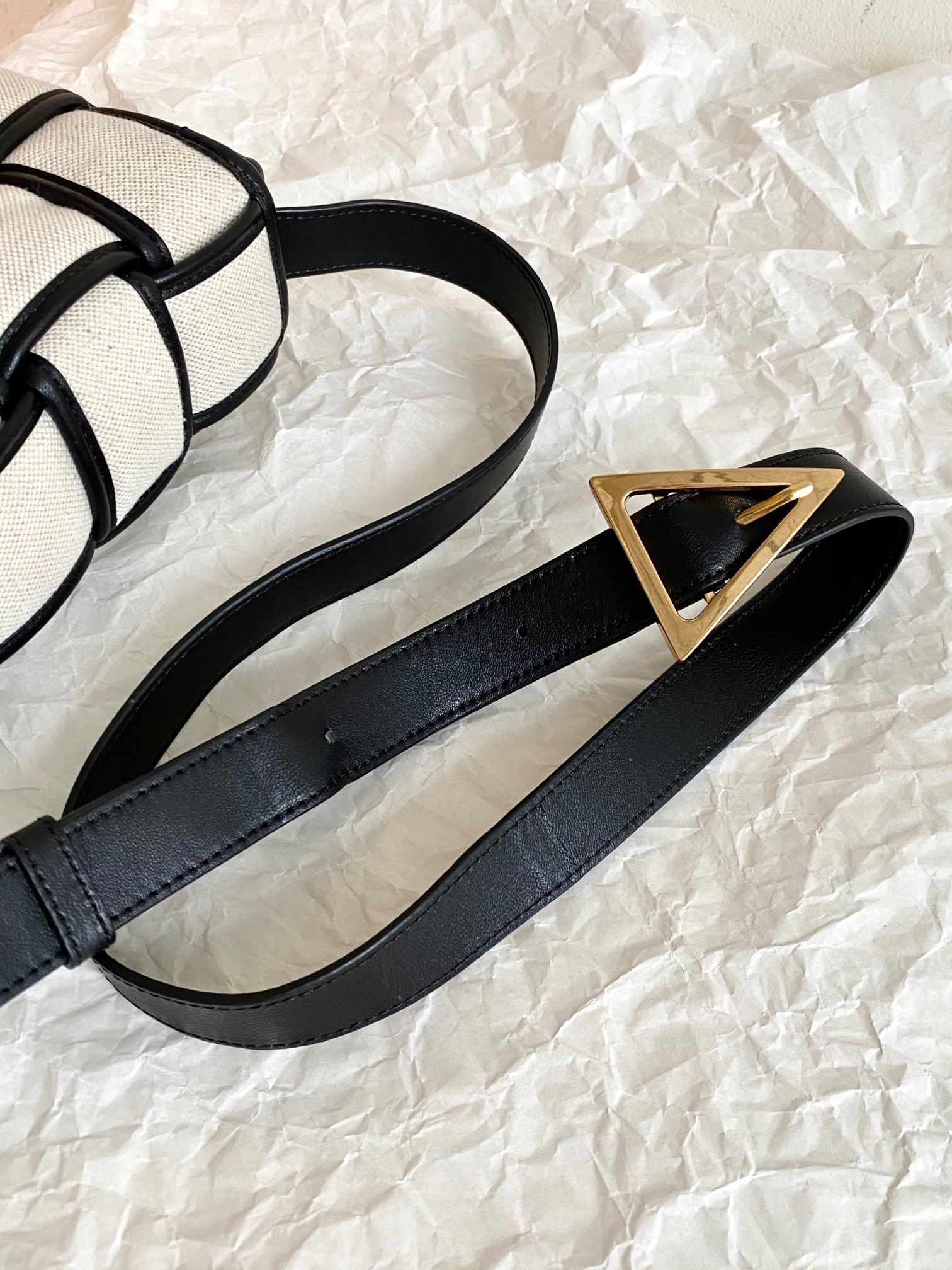 bo*te*ga Ve*ne*ta padded cassette bag in natural canvas
